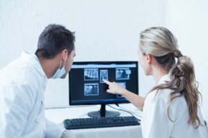 tow dentists viewing x-ray results